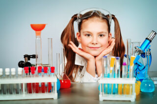 The girl is creating a chemical science project for homeschool
