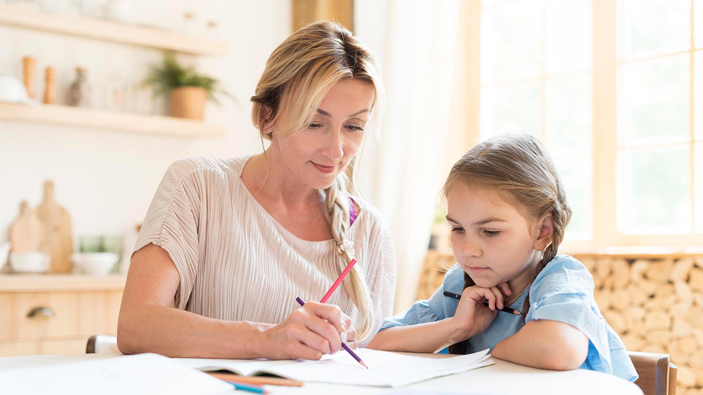 mother-daughter-doing-homework-home