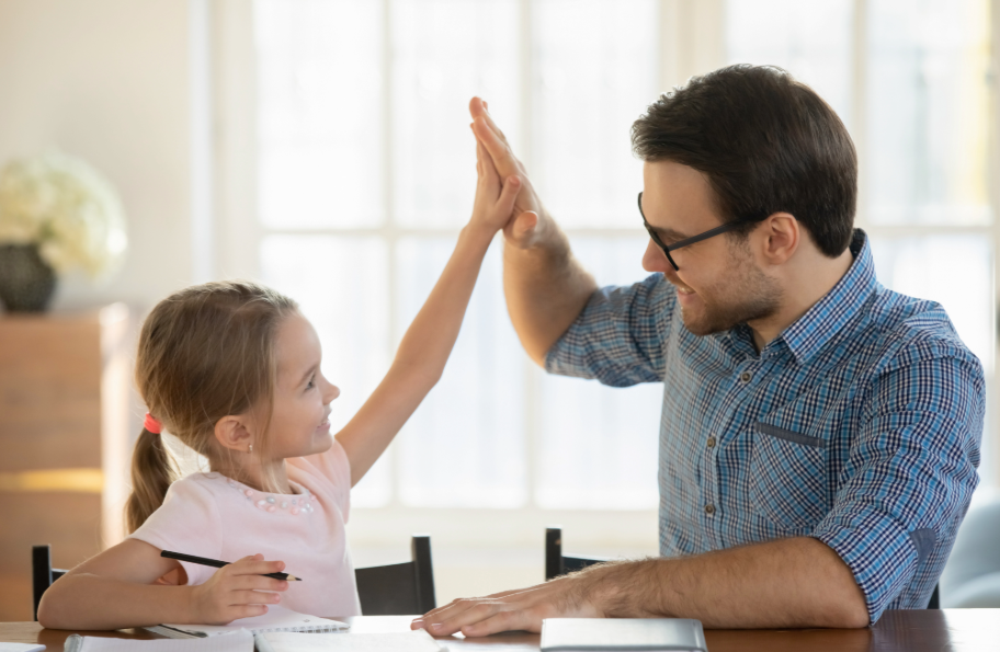 Now we teach the academics in a homeschool The father is helping his daughter with her homeschool studies, and both are very happy